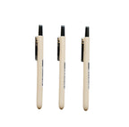 Three beige retractable ballpoint pens with black tips and black printed text, arranged vertically on a plain white background.